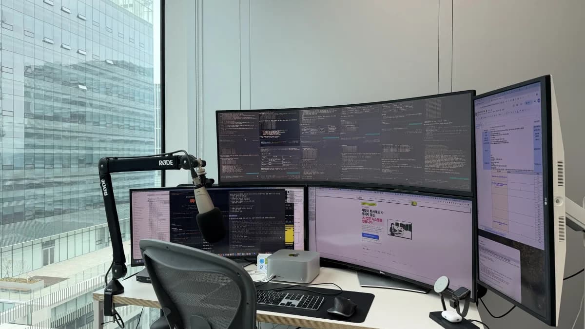 QuantumJumpClub CEO's AI Command Center — 4 ultrawide monitors and Mac Studio